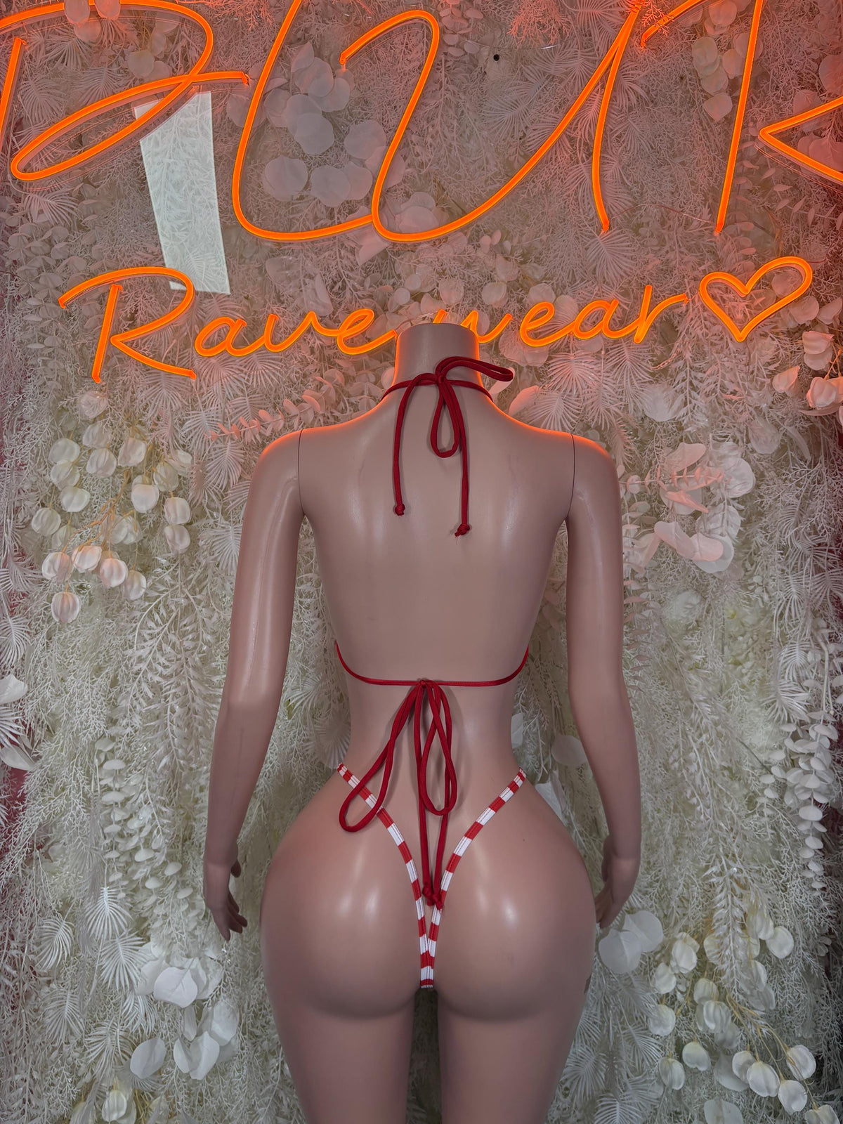Back view red and white striped bodysuit with crisscross tie straps and thong back