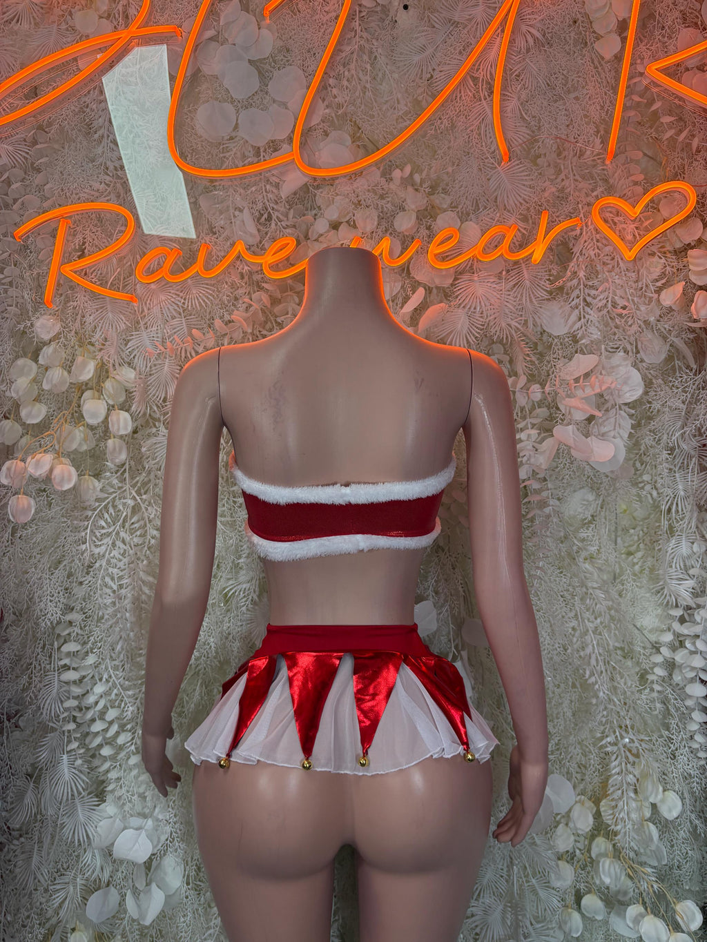 Back view of red and white bandeau top and layered mini skirt set