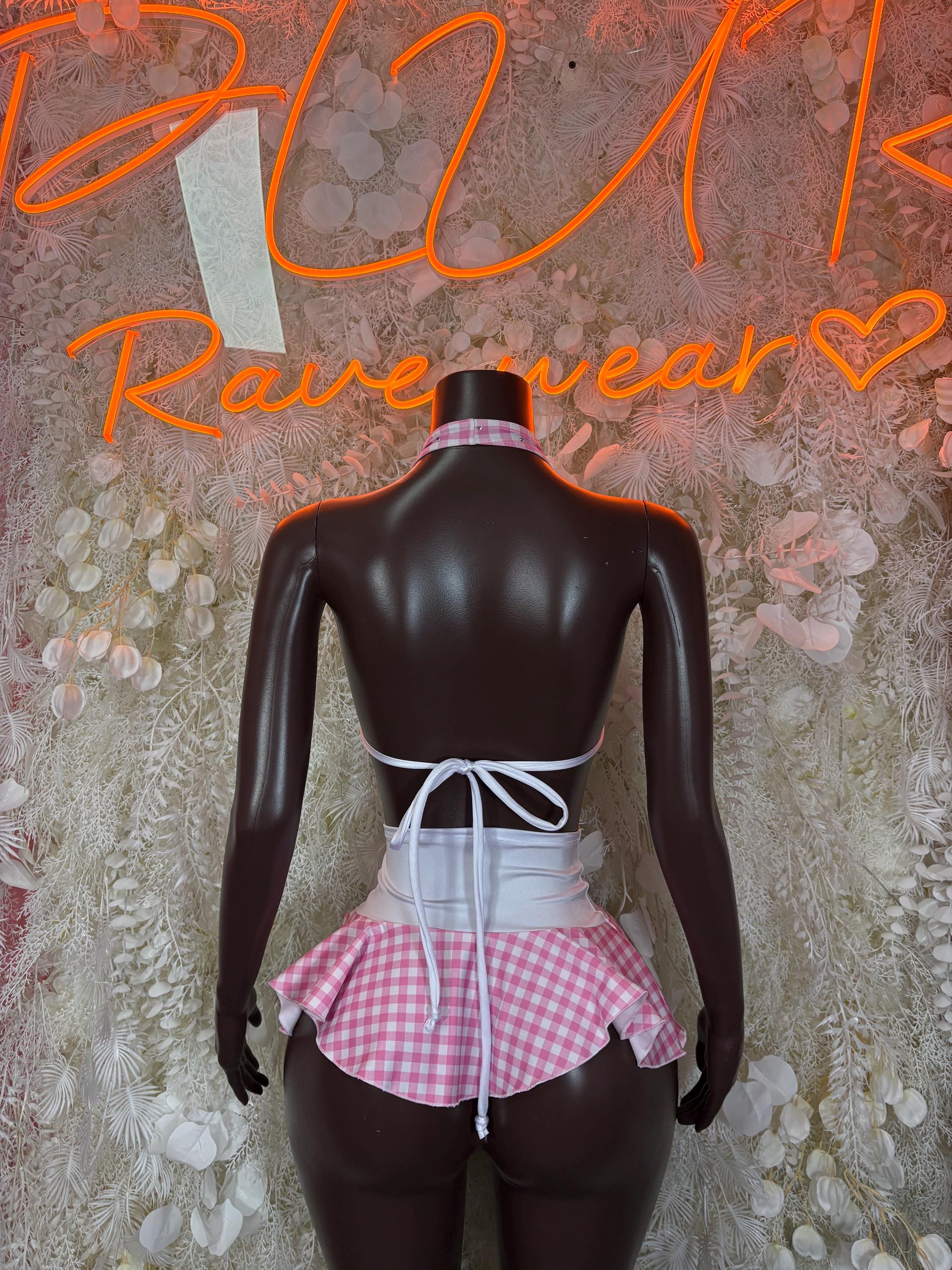 Pink and white check halter bikini top and ruffled mini skirt, back view