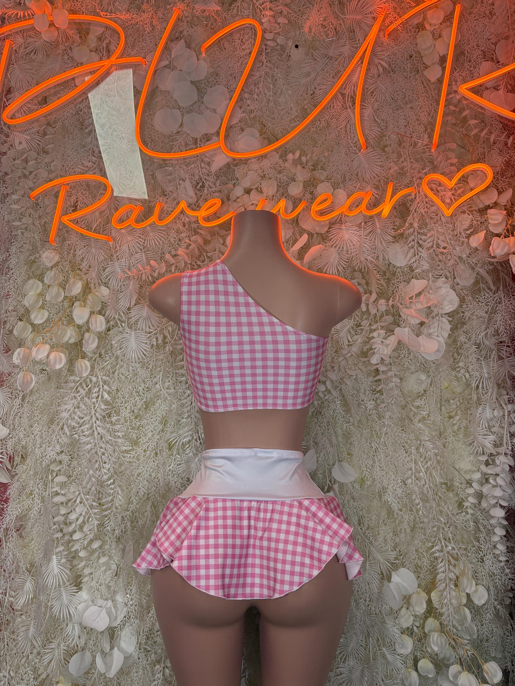 Pink gingham halter crop top with open back and ruffled mini skirt, white waistband