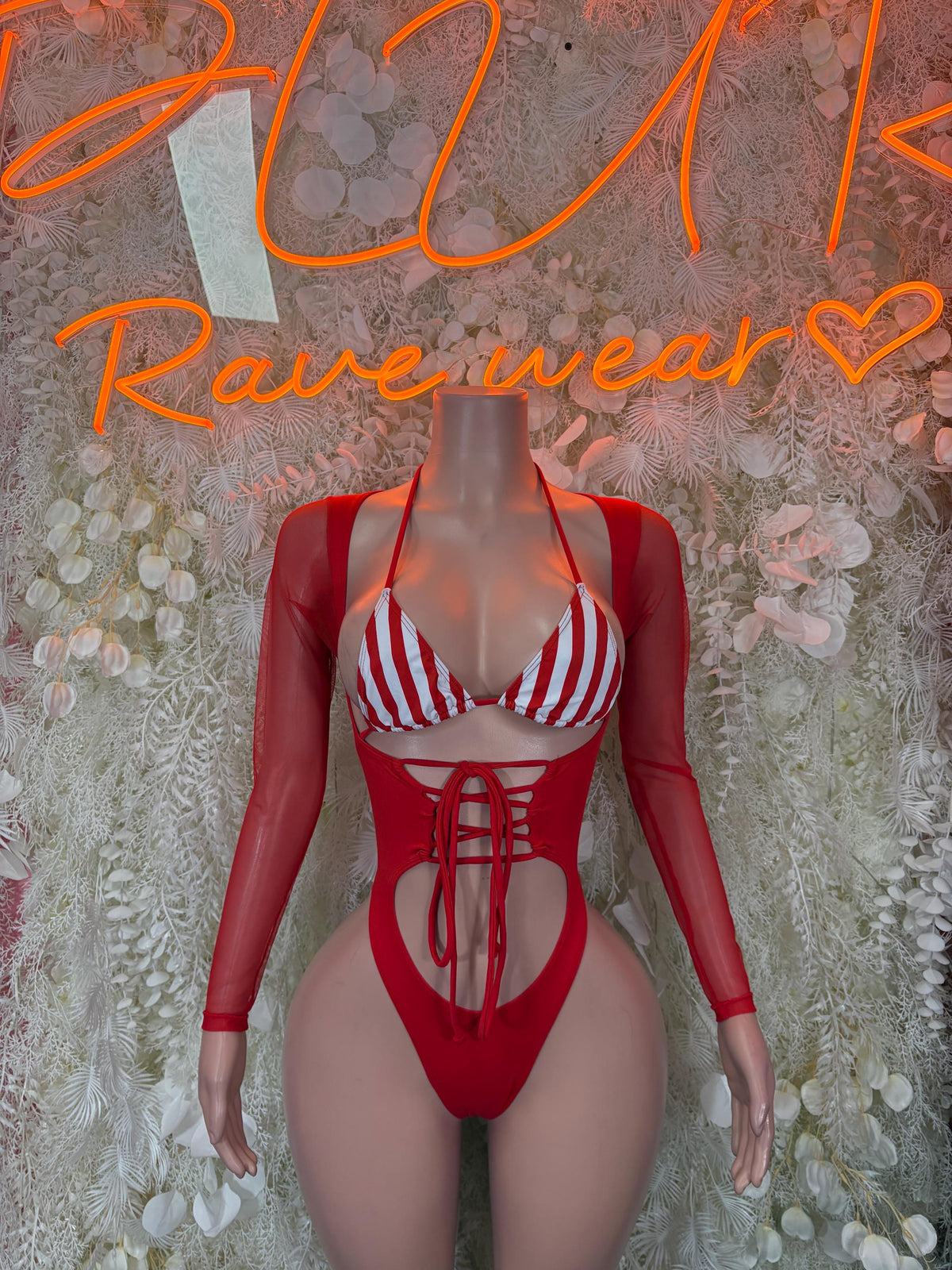 Red Santa bodysuit costume with white striped cups and red lace-up front, long sleeves