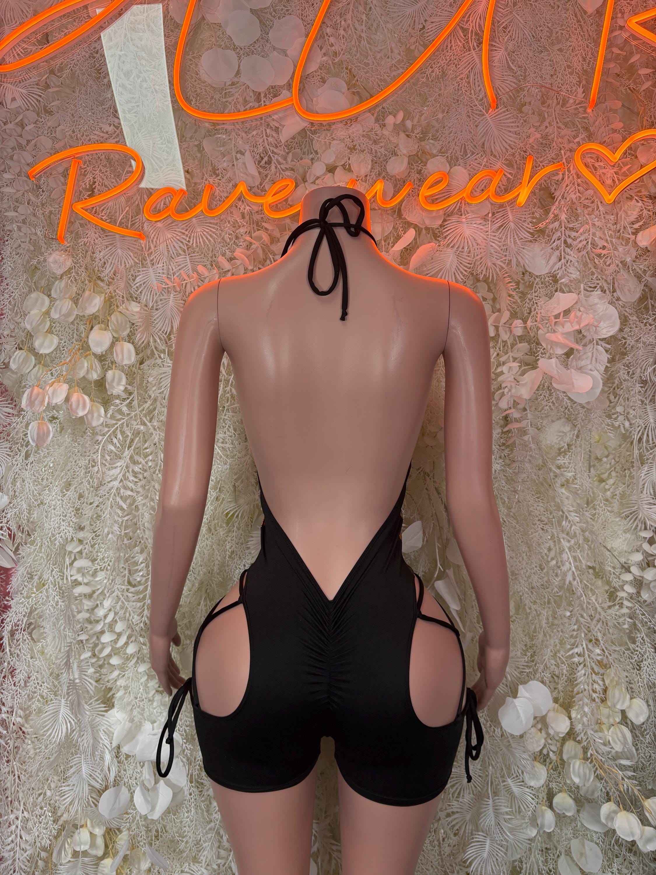 Black backless bodysuit with halter ties and side circular cutouts