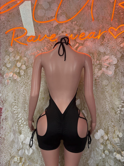 Black backless bodysuit with halter ties and side circular cutouts