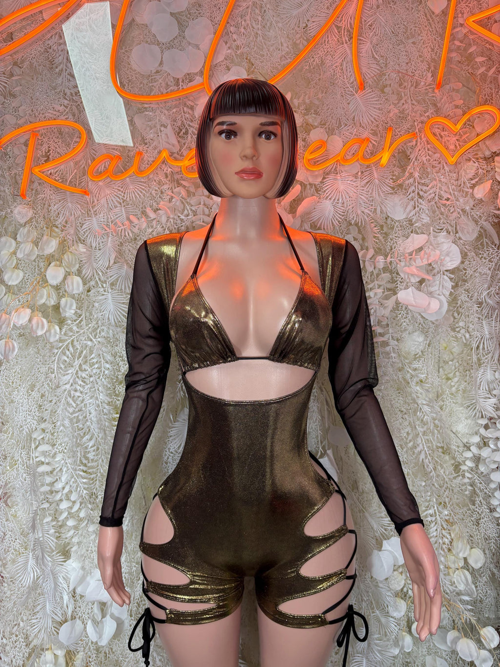 Metallic gold bodysuit with black sheer sleeves and bra-style cutout front