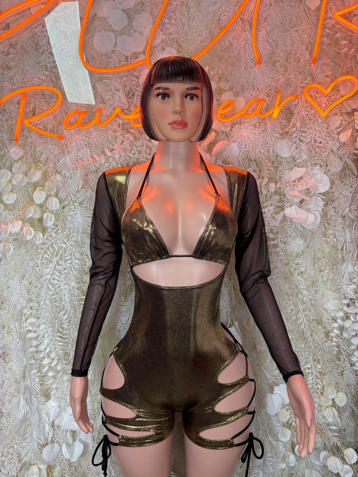 Metallic gold bodysuit with black sheer sleeves and bra-style cutout front