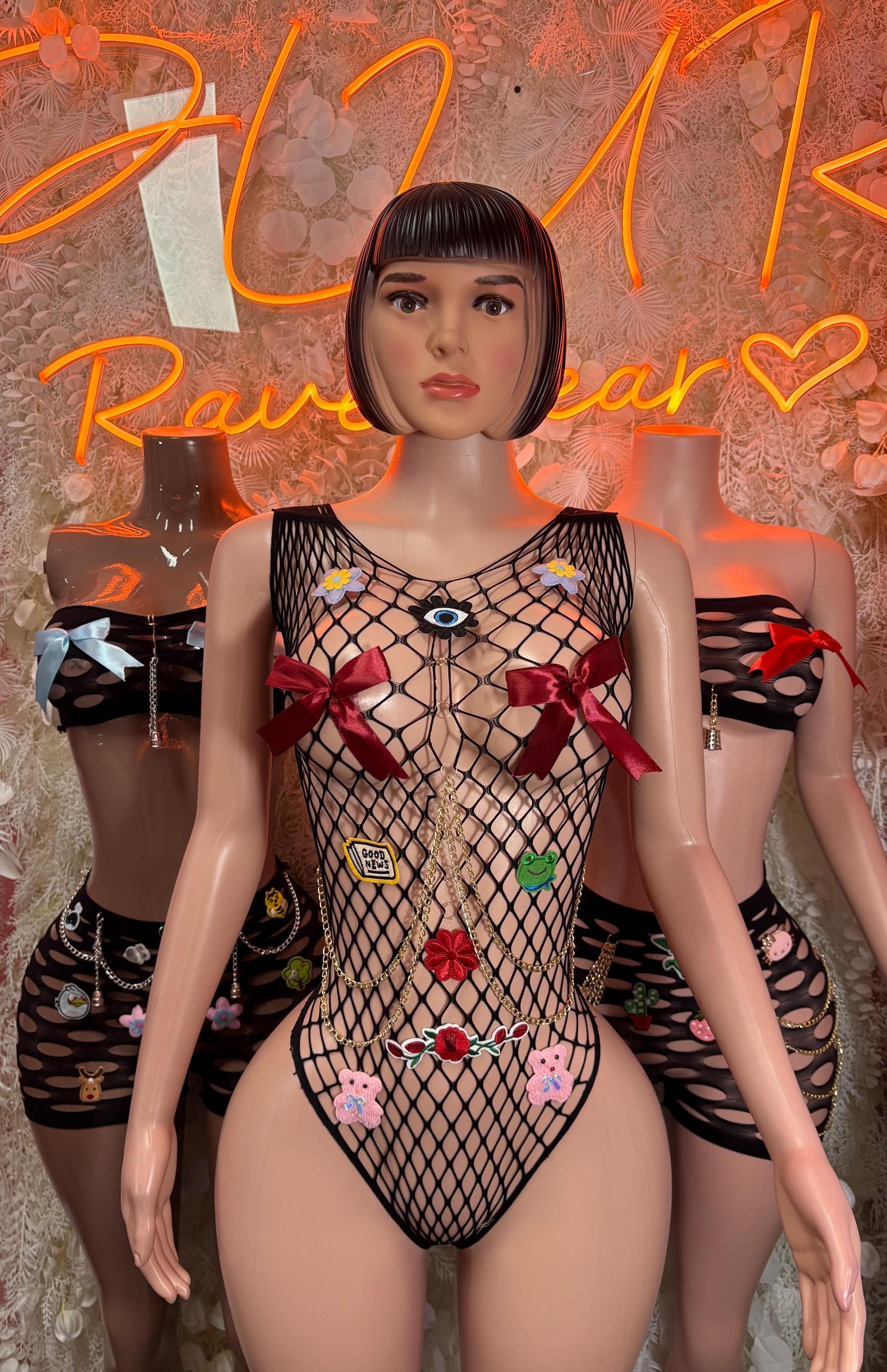 Fishnet dance bodysuit with red ribbon details and multicolor heart embroidery