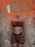 Two-piece dancewear set with black mesh top, red tie straps, and matching shorts
