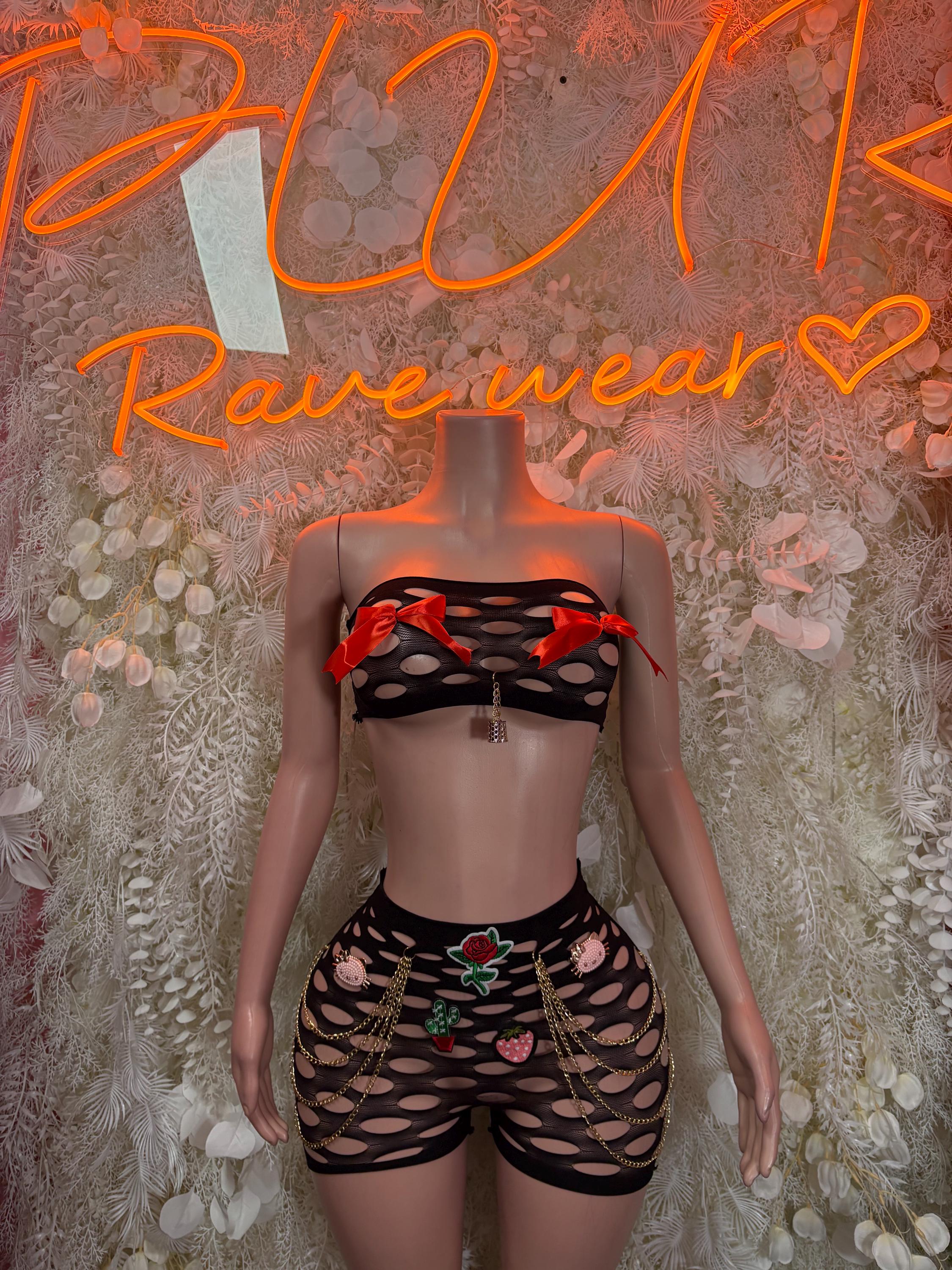 Two-piece dancewear set with black mesh top, red tie straps, and matching shorts