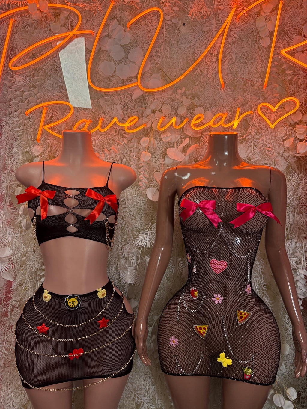 Black mesh two-piece dancewear set with heart bow accents and pin-style appliqués