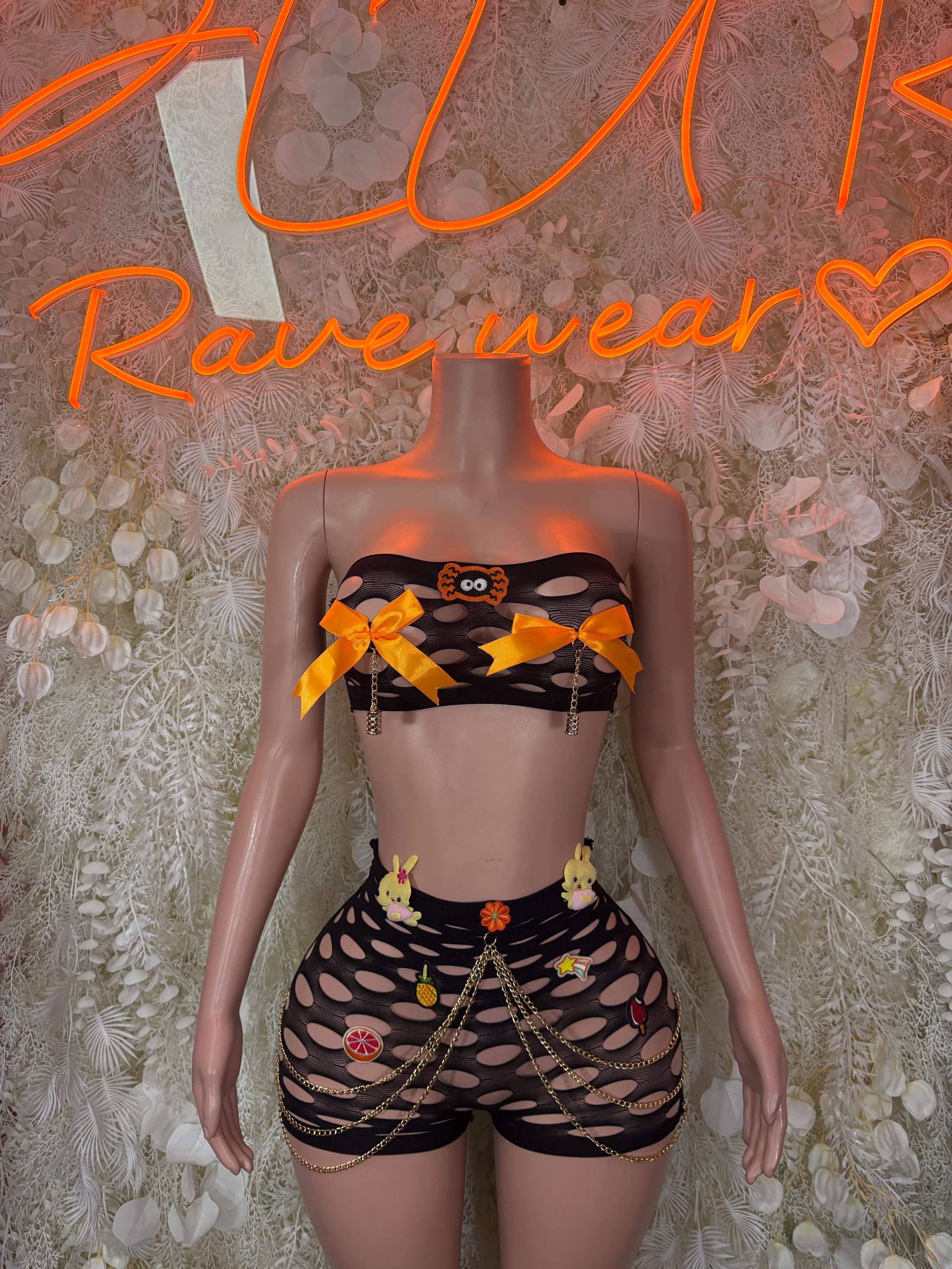 Black fishnet pinned two-piece set with bow accents and high-waist shorts