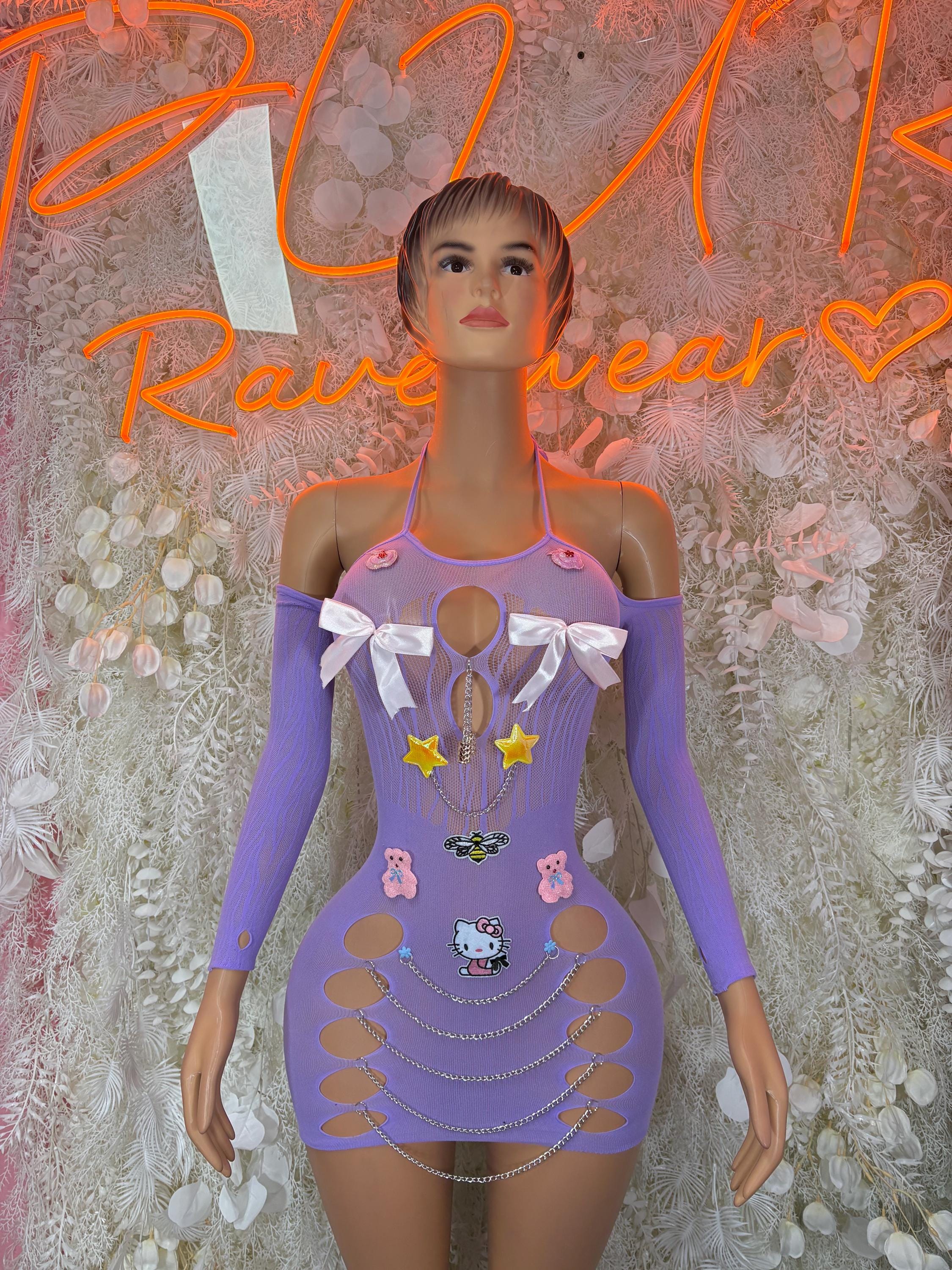 Purple mini dress with bow accents, graphic panels, and long sheer sleeves