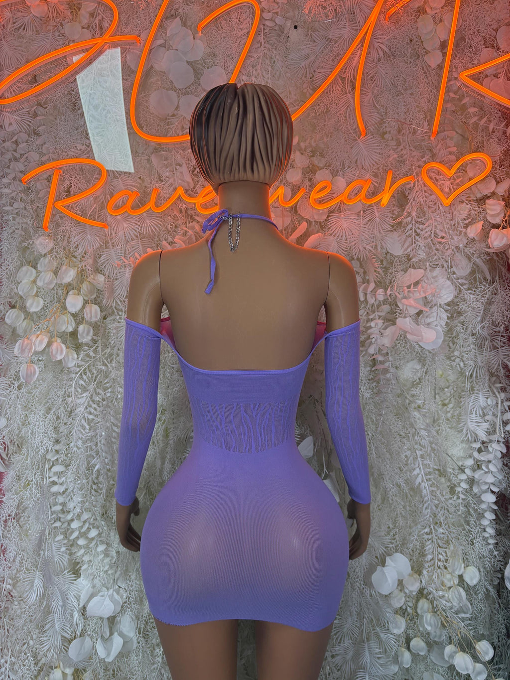 Back view of purple mini dress with open back and long sheer sleeves