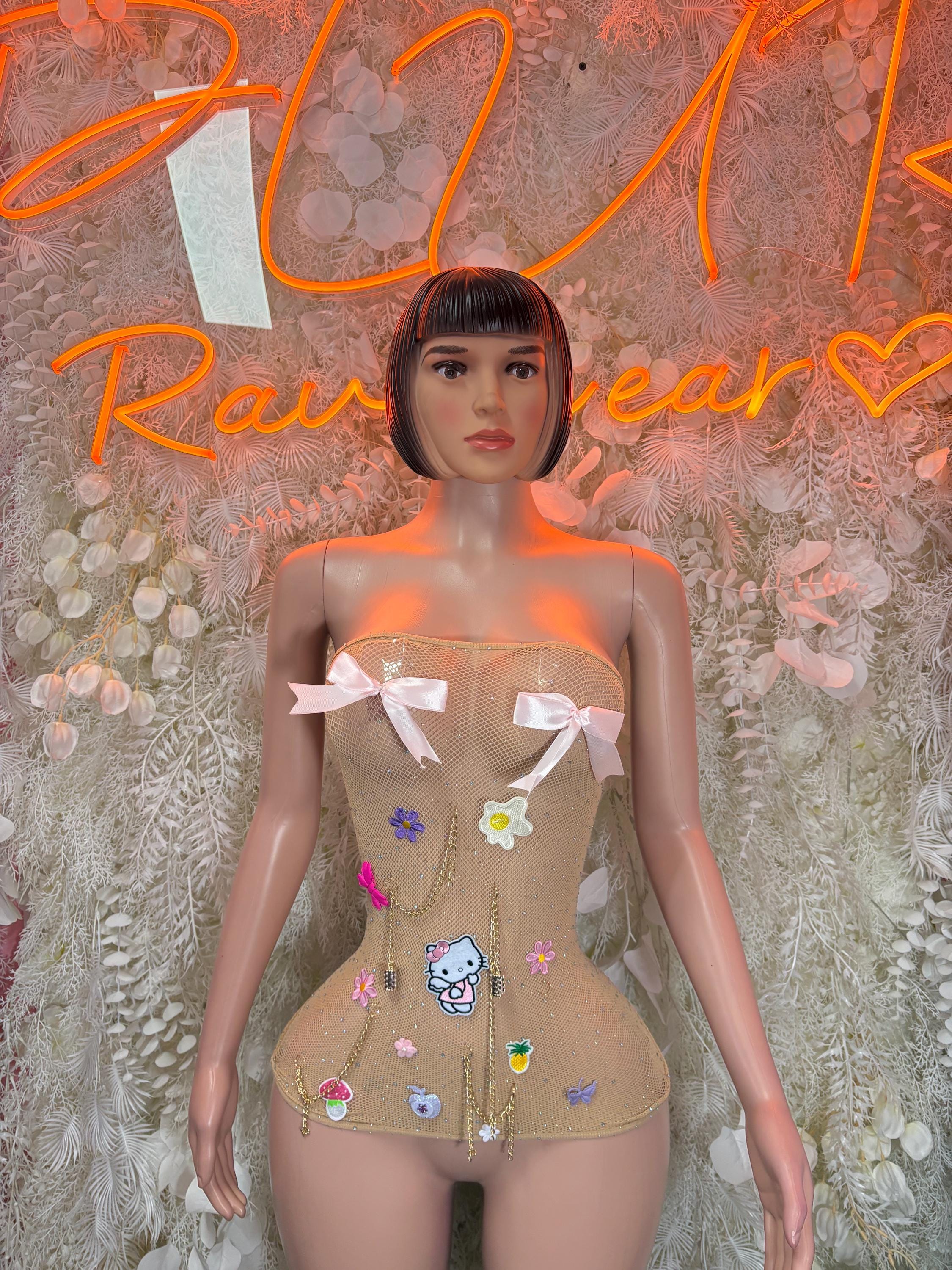 Fishnet rave dress, nude mini with white bows and colorful charm patches