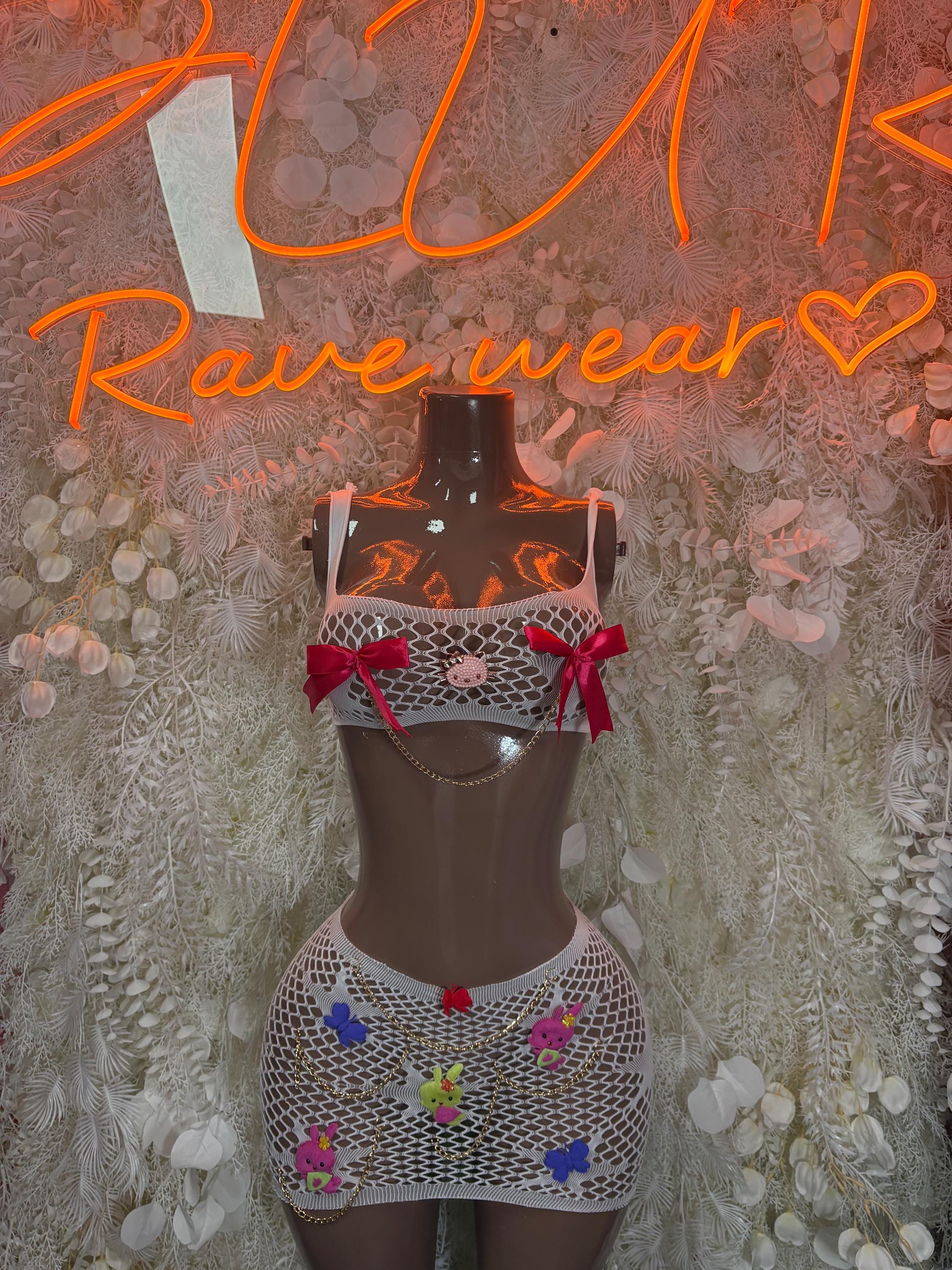 White fishnet two-piece dance set with red bows, cropped top and mini skirt