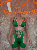 Green holiday bodysuit with red-white striped panels and front crisscross lacing