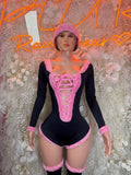 Pink elf bodysuit with lace-up front, long sleeves, and matching hat