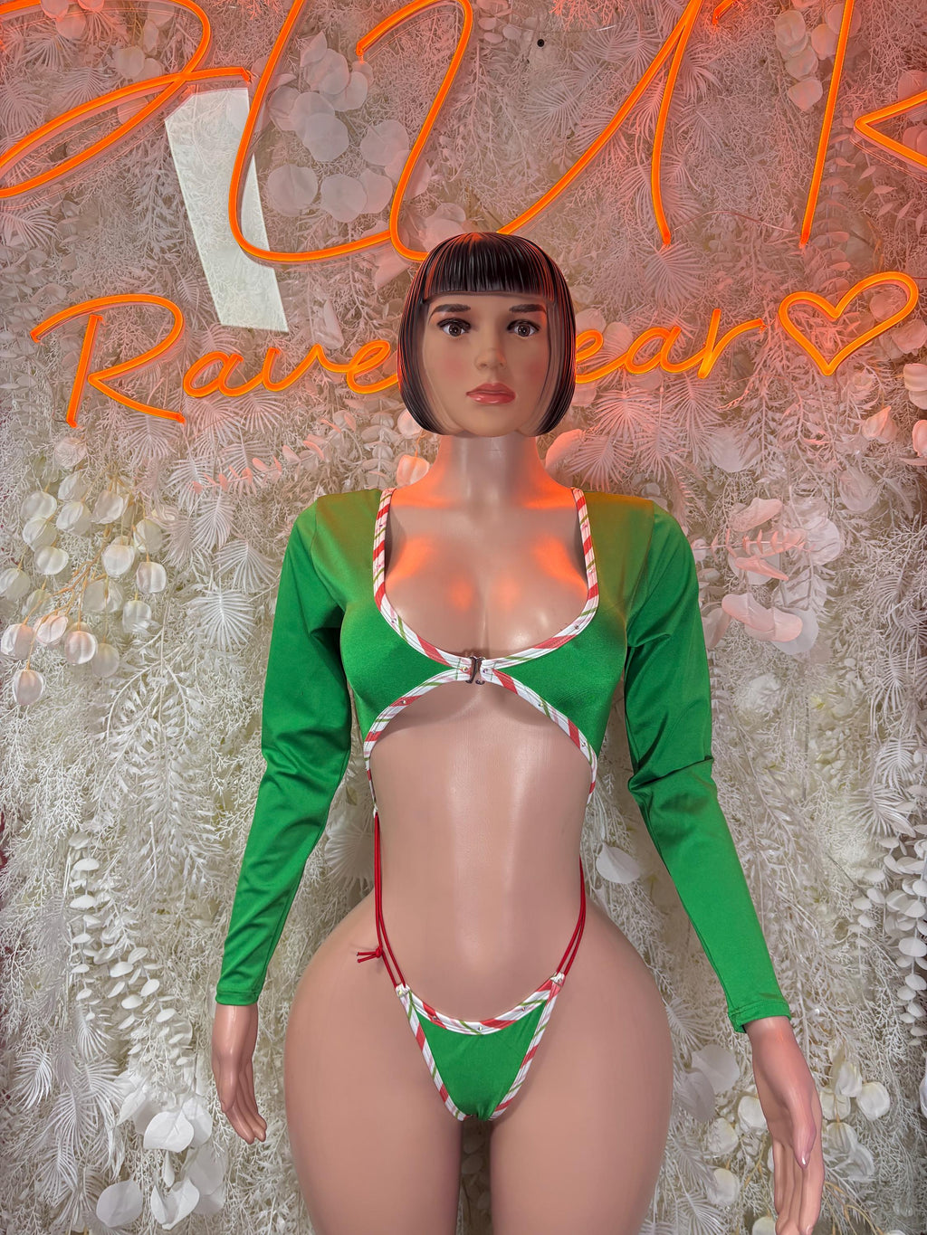 Green long-sleeve bodysuit with red-and-white striped trim and thong-style bottom