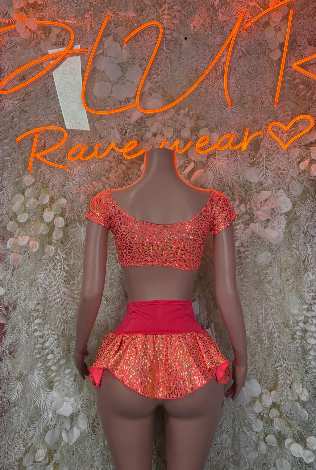 Coral cheetah-print crop top with cap sleeves and matching flared mini skirt