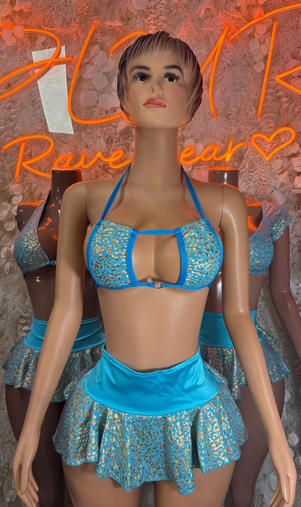 Blue hologram halter top and cheetah-print ruffle skirt set, front close-up