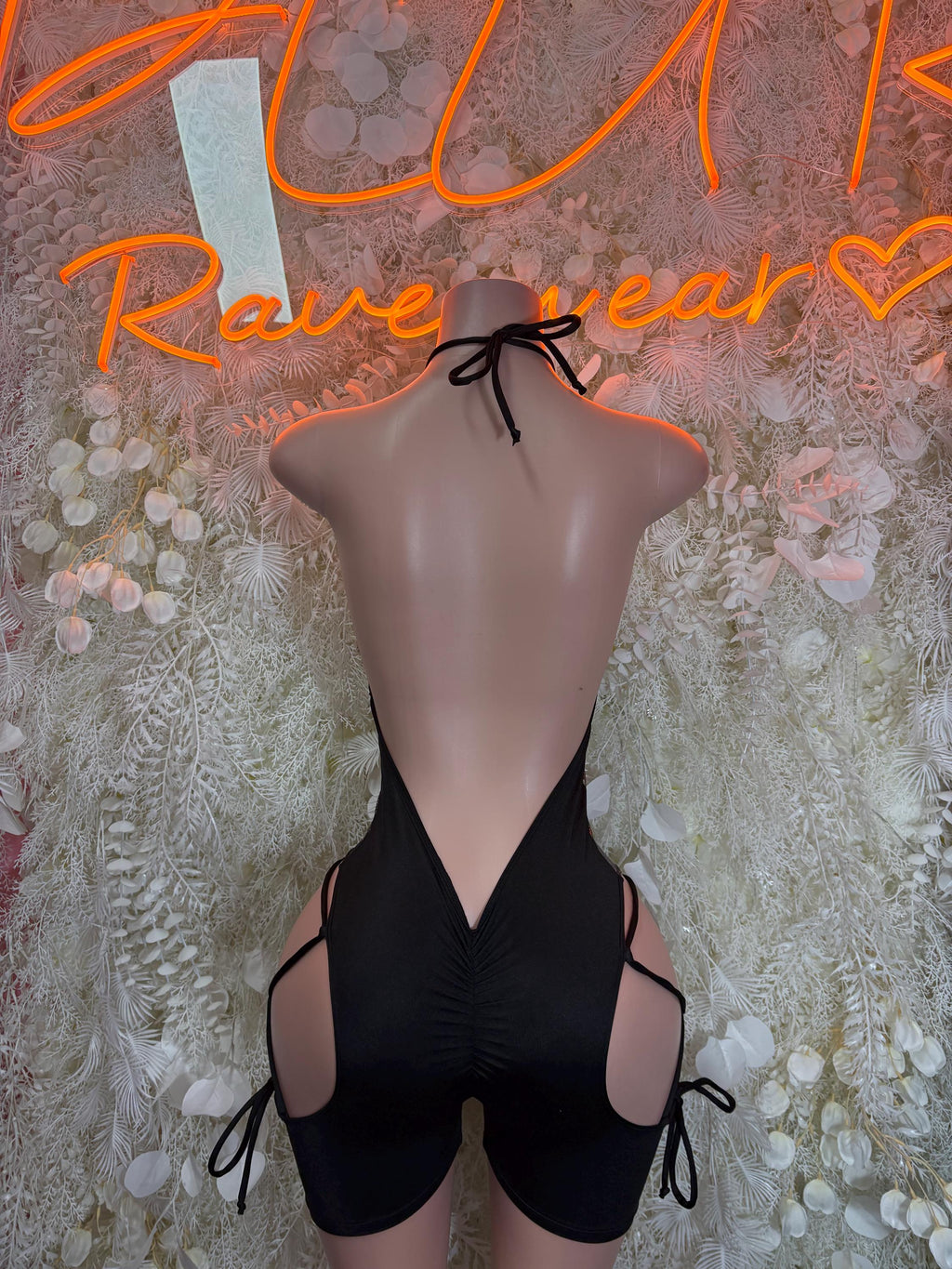 Black metallic one-piece bodysuit, deep V neckline with side lace-up leg cutouts