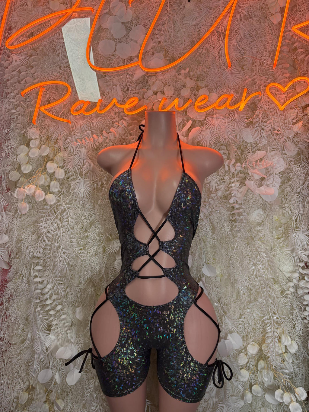 Black metallic one-piece bodysuit with halter straps, lace-up crisscross cutouts
