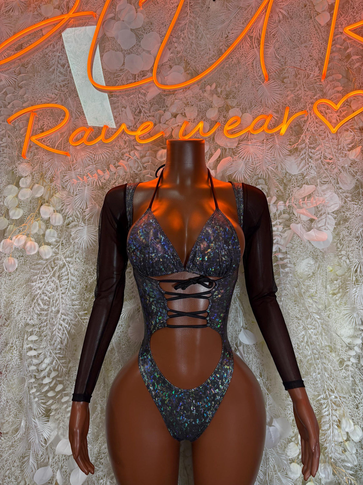 Black long-sleeve mesh bodysuit with metallic blue glitter V-neck and lace-up sides