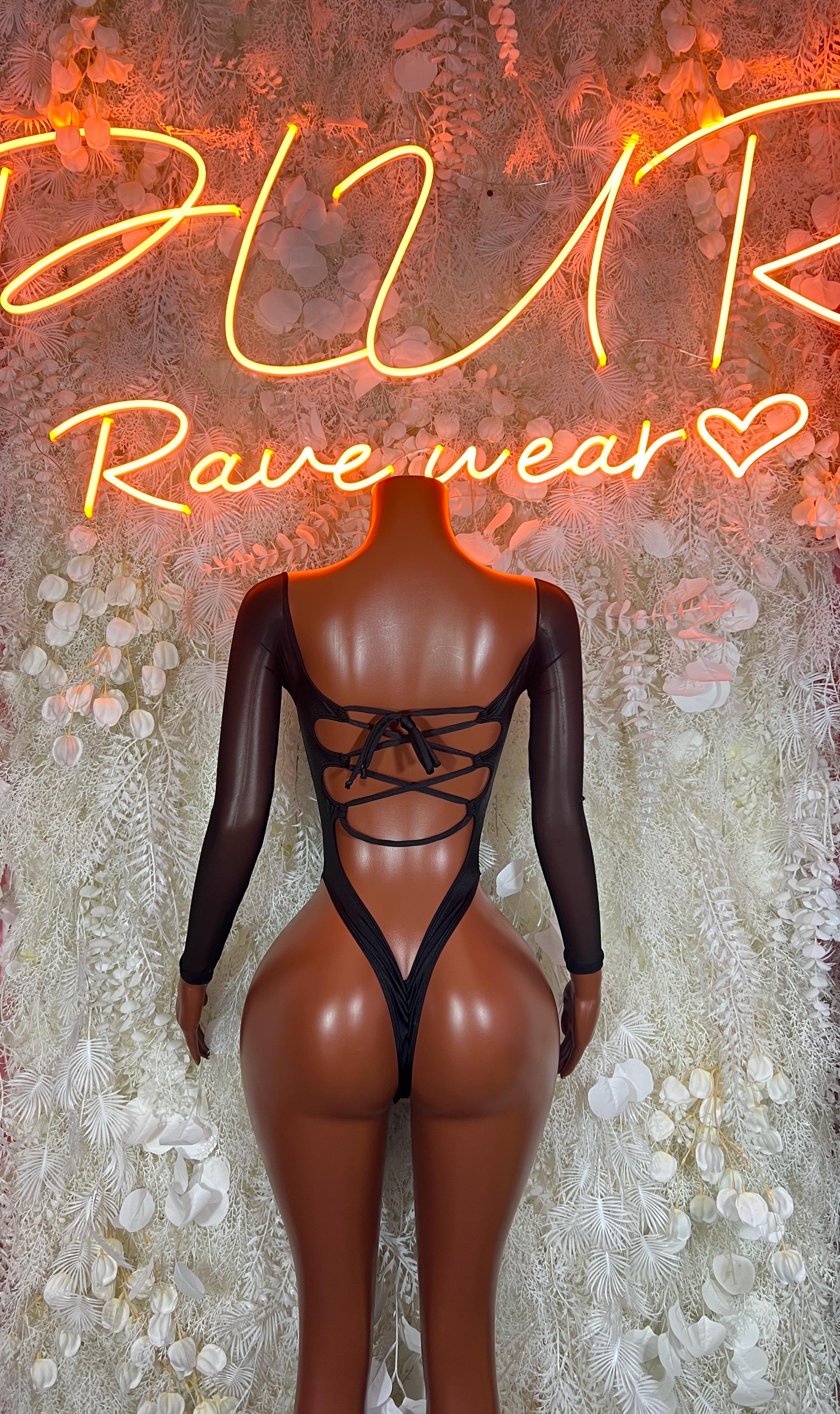 Green cheetah print bodysuit with black long sleeves and crisscross lace-up back