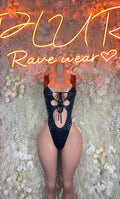 Dark sleeveless bodysuit with lace-up crisscross back and high-cut leg openings