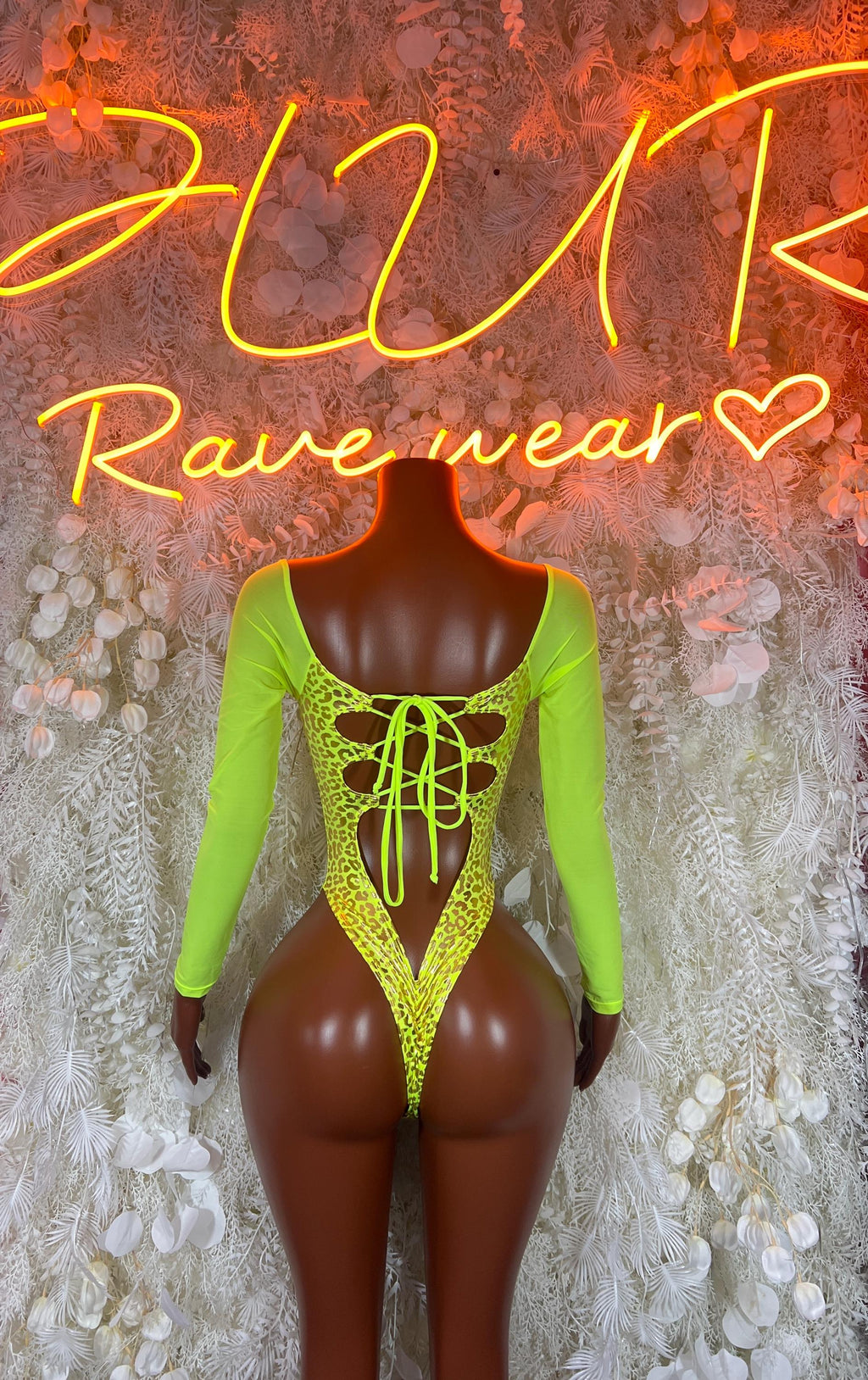 Neon green cheetah-print bodysuit, open back with center lace-up and long sleeves
