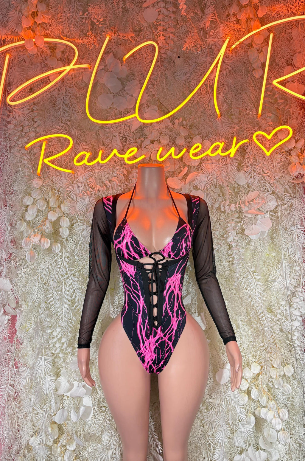 Black long-sleeve bodysuit with neon pink lightning graphics and deep V neckline