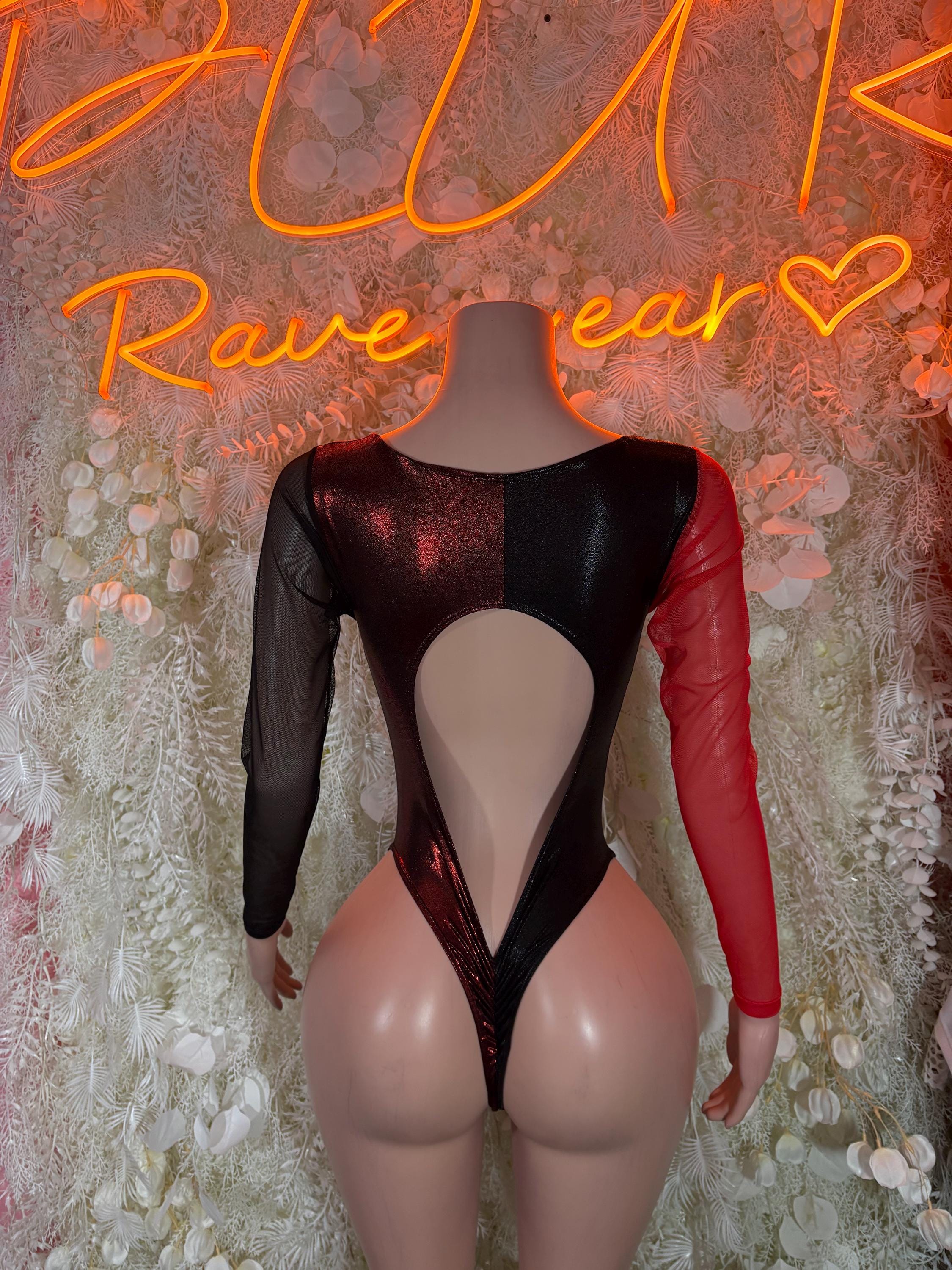 Black bodysuit with open back and teardrop cutout; red sleeves