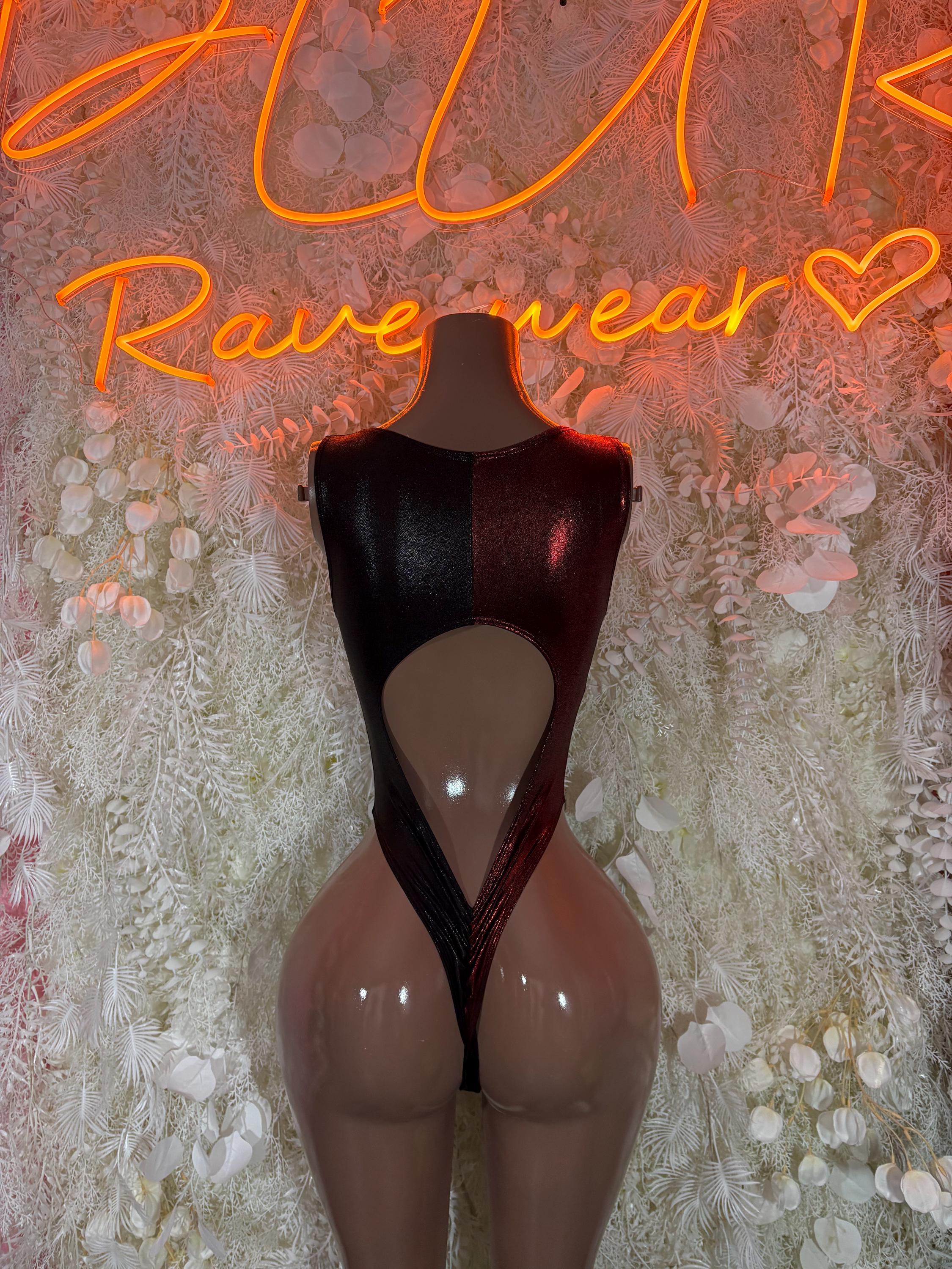Black glossy one-piece bodysuit with high-cut legs and center bust cutout