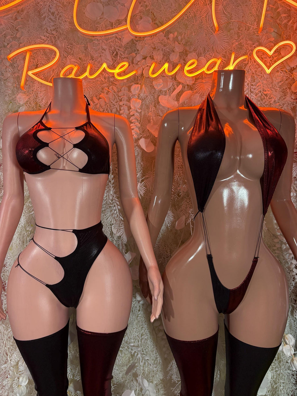 Black strappy two-piece rave outfit with cutout bra, bottoms, and thigh-high stockings