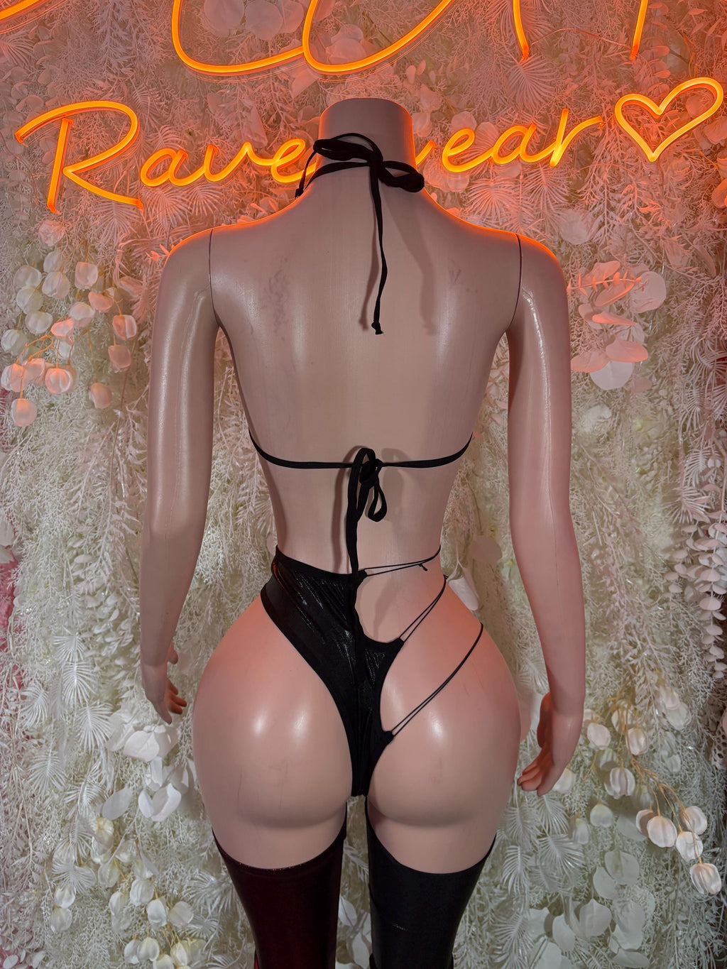 Black strappy backless bra and matching thong with thigh-high stockings