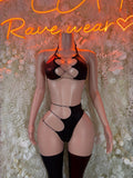 Black strappy rave lingerie set with matching bottoms and thigh-high stockings