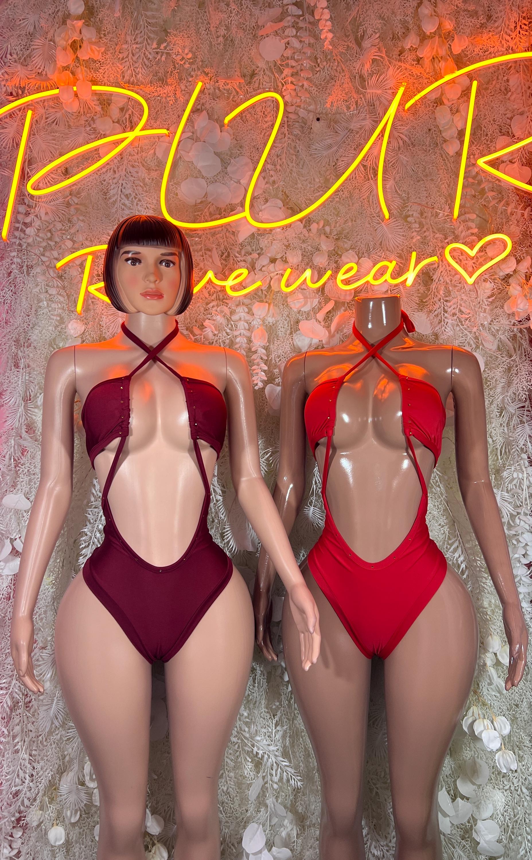 Pair of burgundy and red halter bodysuits with crisscross neck straps