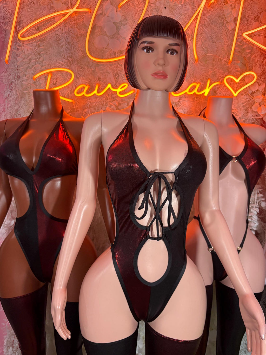 Front view dark red and black lace-up bodysuit with chest tie cutouts and leggings