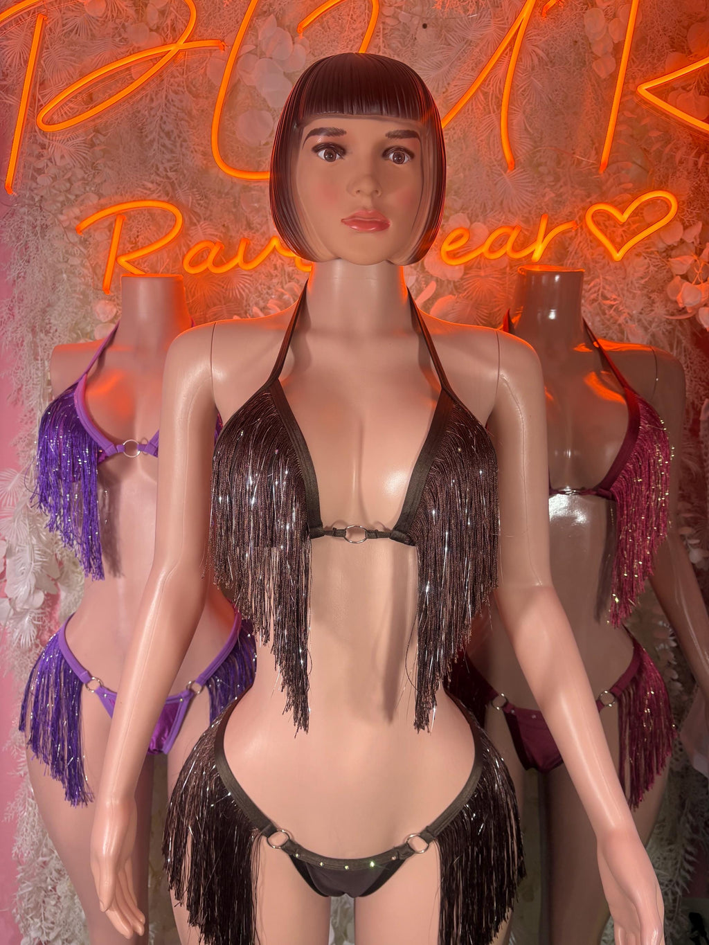 Dark fringe two-piece set with halter bra and bikini bottoms on mannequin