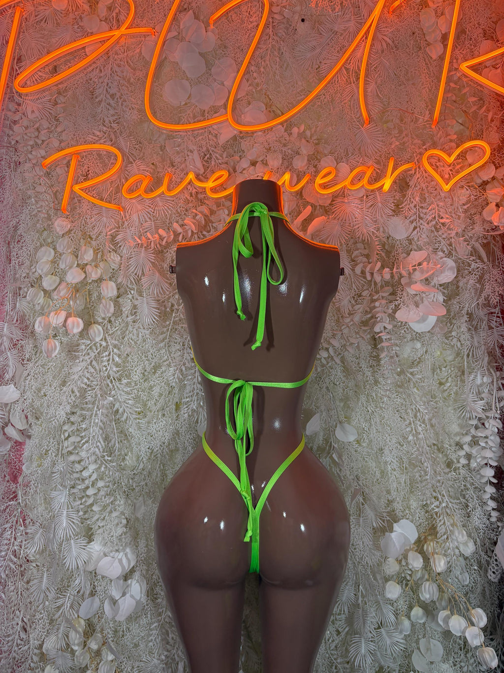 Rave bodysuit with black mesh and neon green tie straps, front view