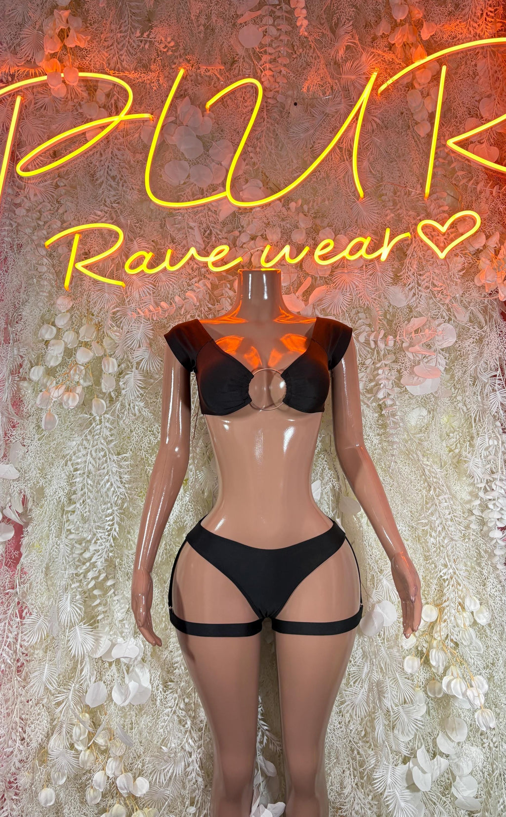 Black two-piece rave bodysuit with corset-style cup top and garter straps