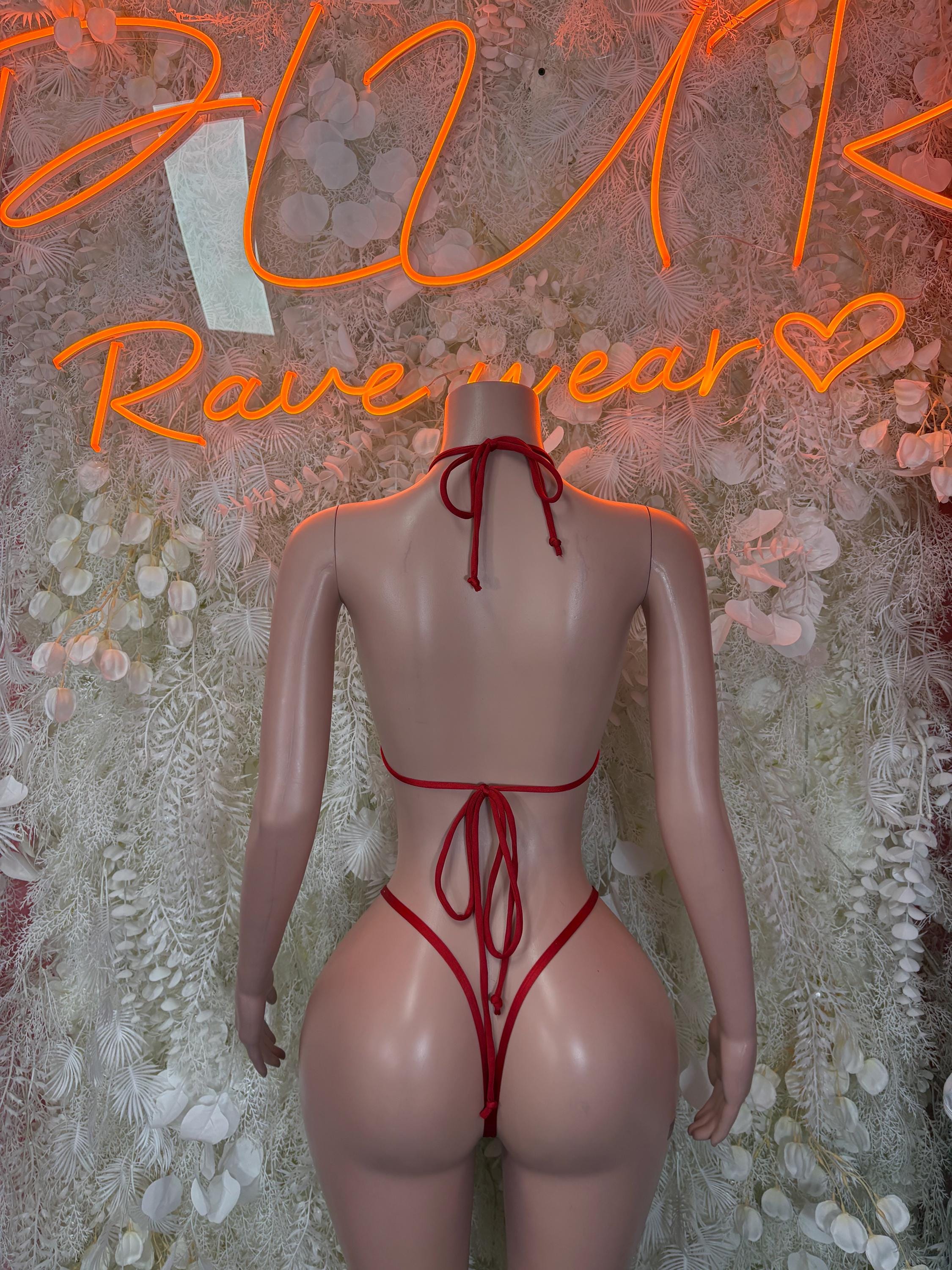 Red triangle bikini costume with crisscross tie-back and high-cut bottom
