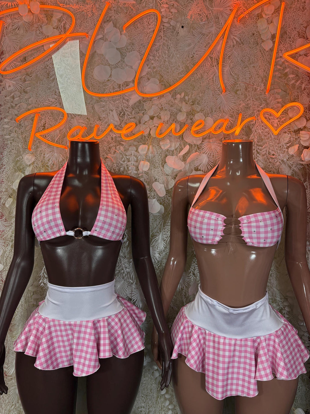 Pink and white check two-piece skirt set on two mannequins, halter top and mini skirt