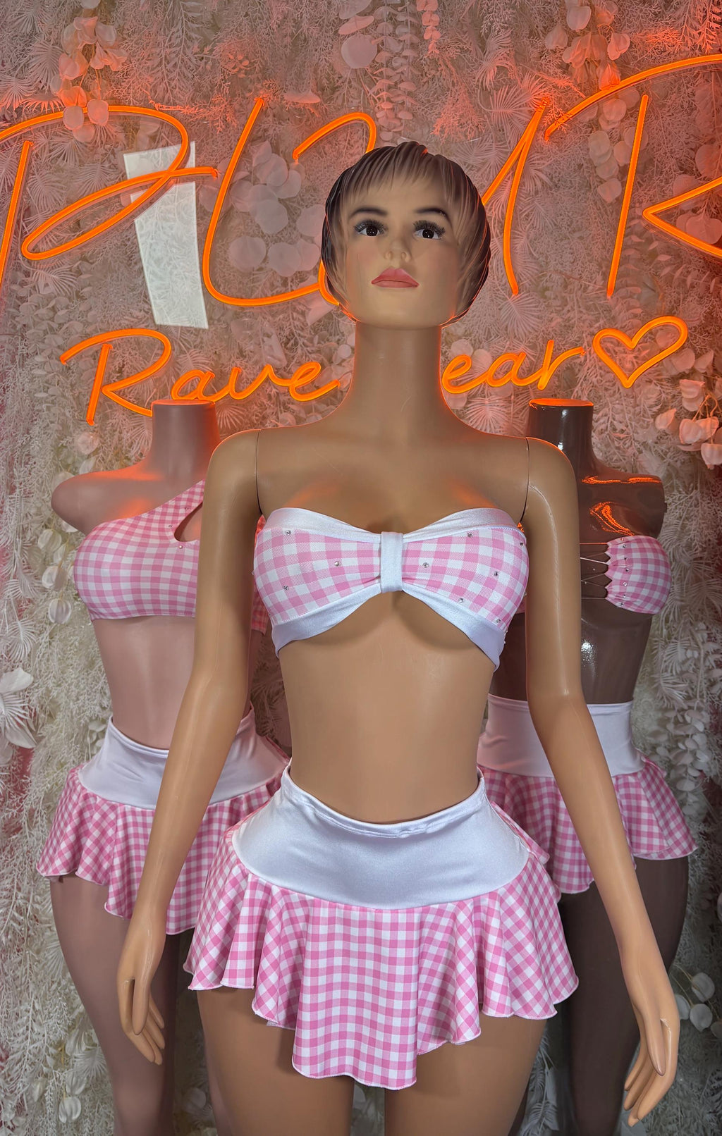Pink gingham two-piece schoolgirl skirt set with bow-front strapless top and pleated mini skirt