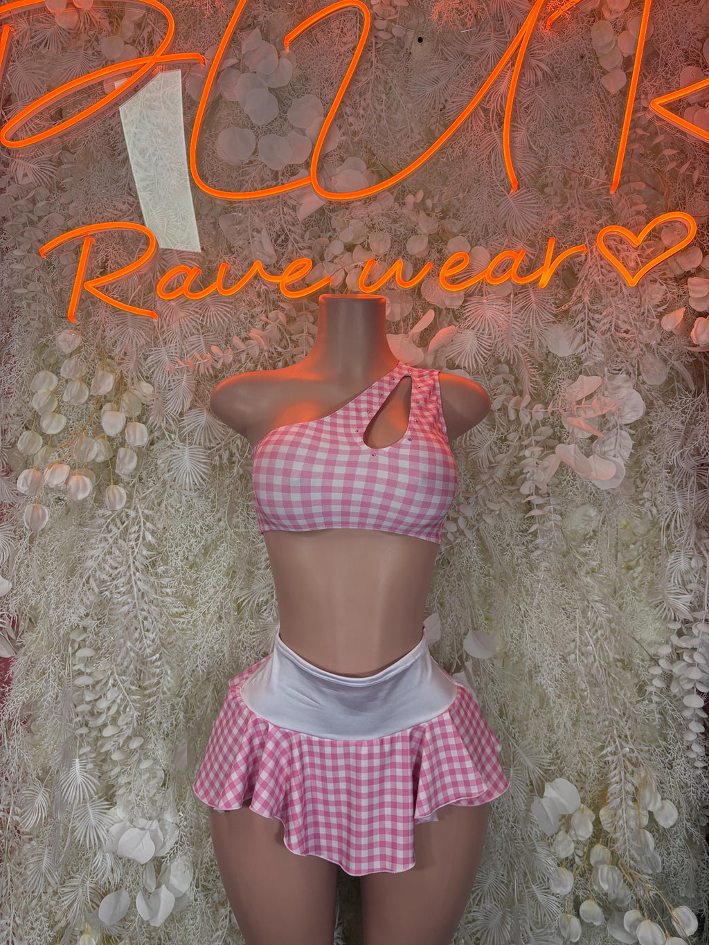 Pink gingham two-piece set with halter crop top and ruffled mini skirt, white waistband