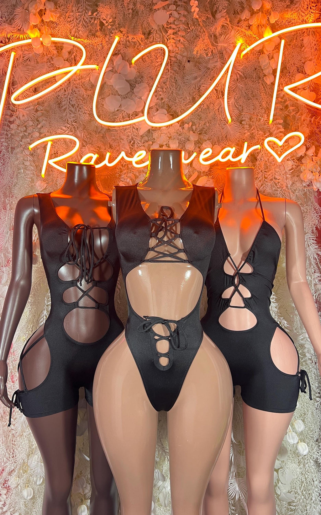 Set of black lace-up cutout bodysuits shown on three models