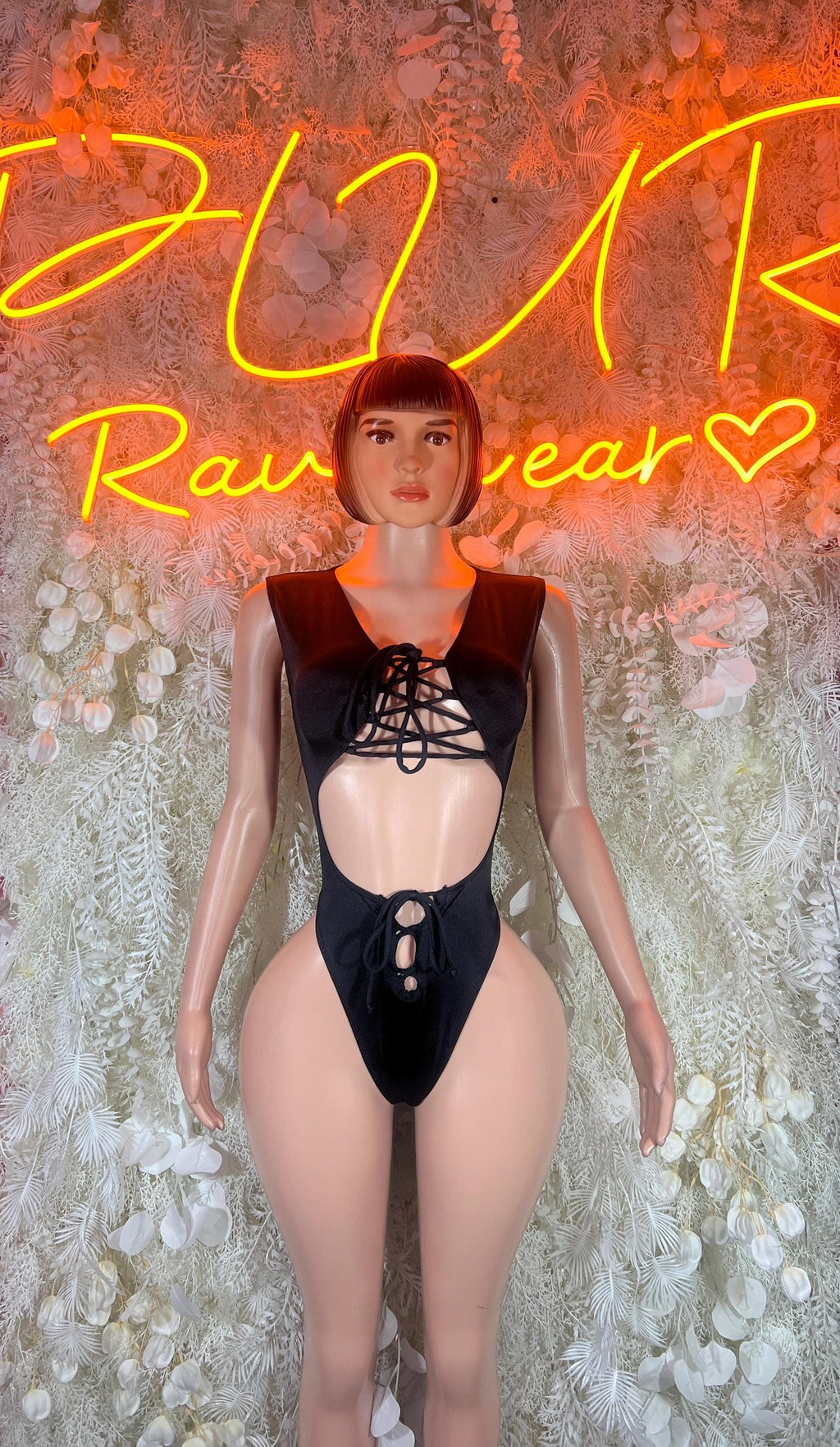 Black lace-up halter bodysuit with cutout bust and high-leg thong bottom