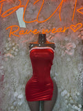 Red satin mini dress with white faux fur trim and sweetheart neckline