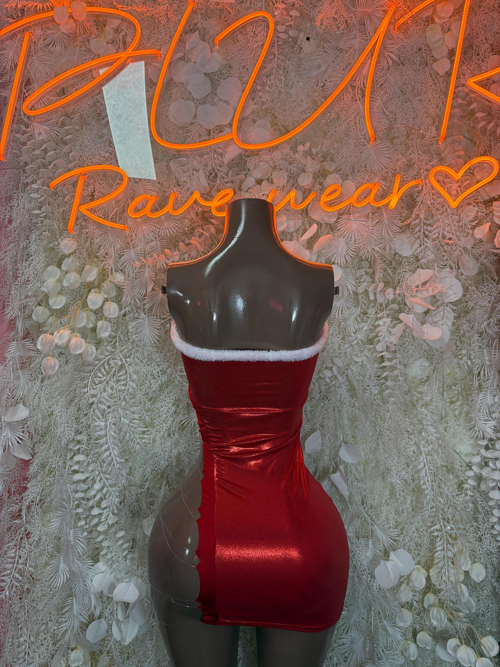Red satin mini dress with white faux fur trim, fitted corset-style bodice