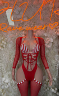 Red holiday bodysuit with white striped cups, lace-up front, long sleeves and garter straps