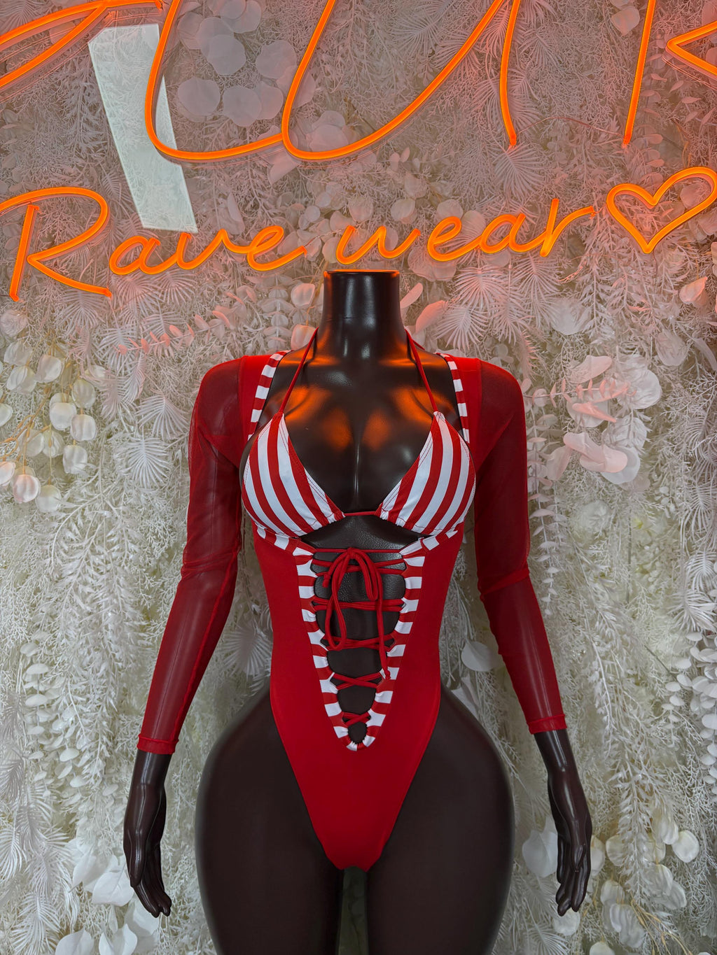 Red Santa-style bodysuit with white striped cups and lace-up front